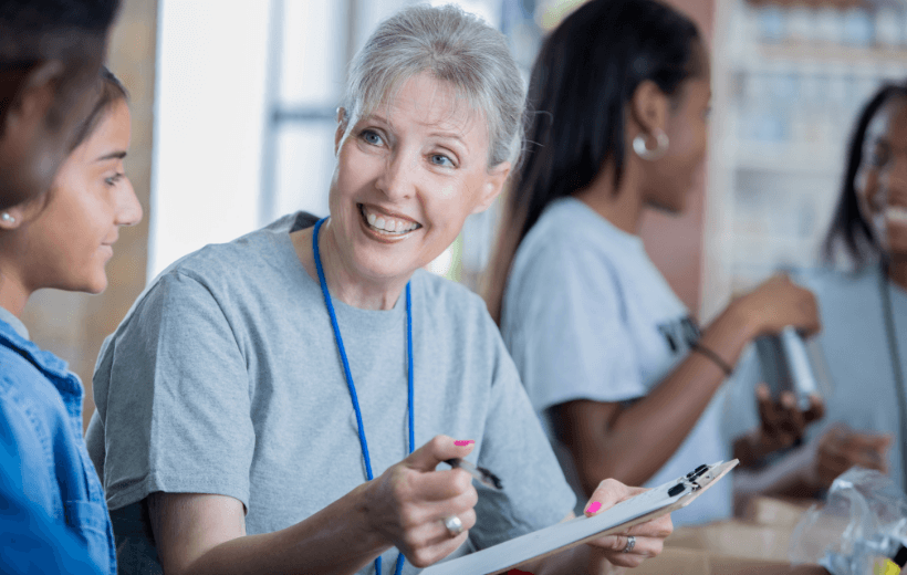 women with clipboard volunteering