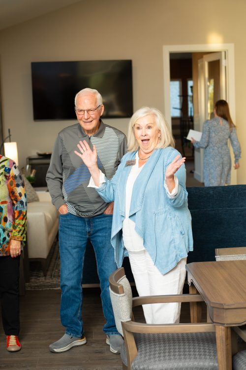 woman and man laughing at an event