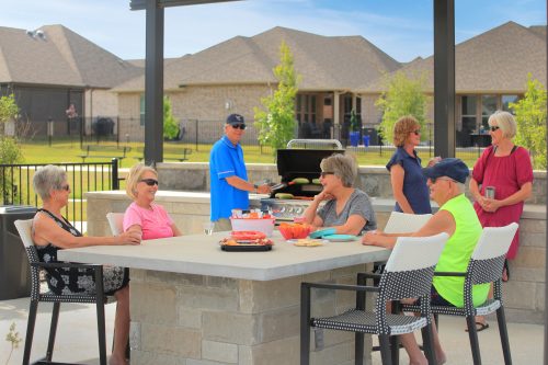 friends gathering having a bbq