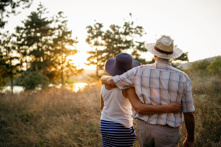 couple walking by lake