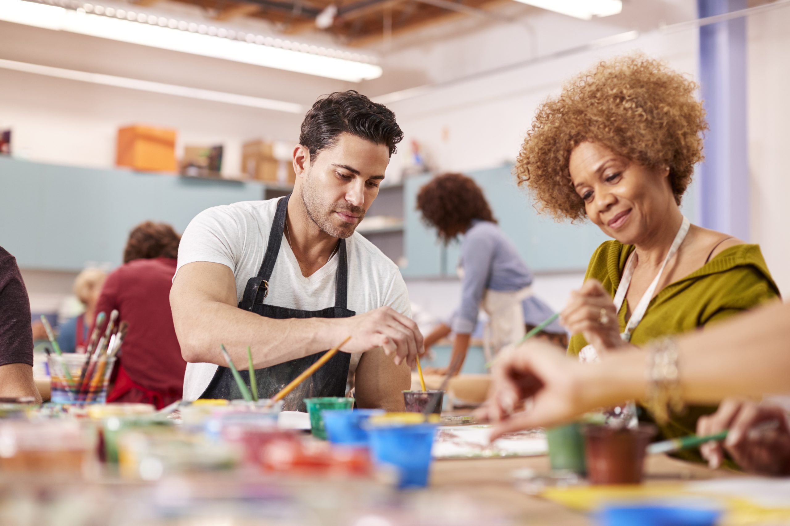 group of mature adults attending art class in comm s4b25vm