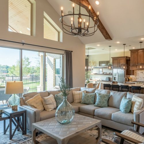 Living room with vaulted ceiling and wall of windows