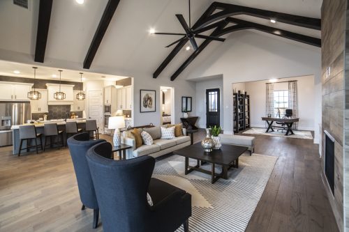 living room with kitchen in background