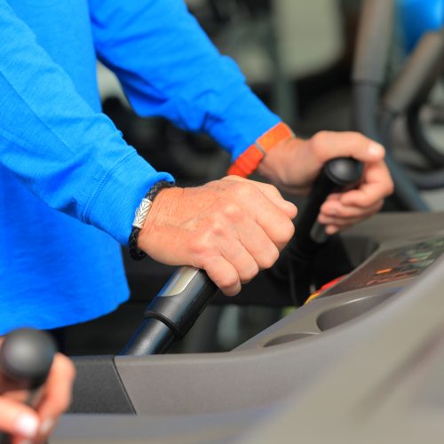 close up of person walking on treadmill