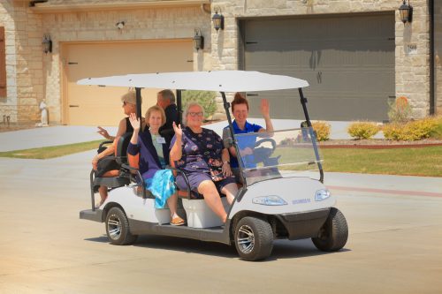 Taking a ride on a golf cart