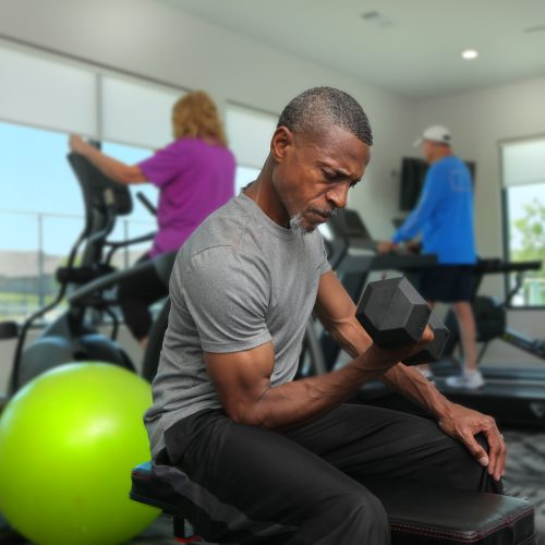 man doing bicep curls with dumbell