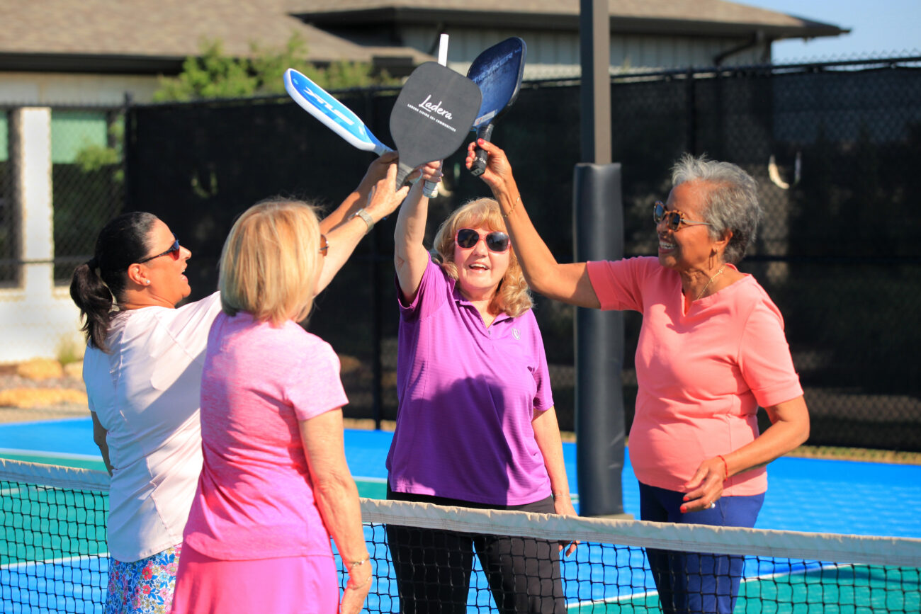 4 women playing pickleball. Power 9 Habits in Ladera Living communities