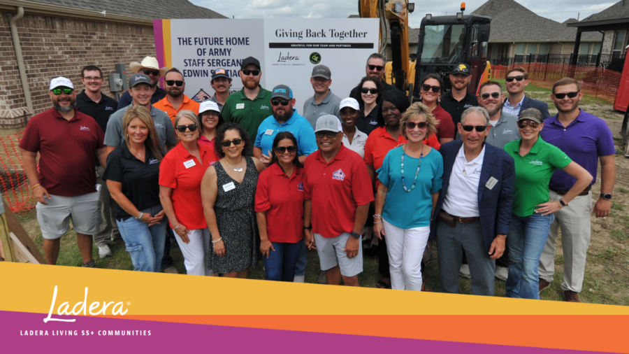 Group of Ladera Living and Building Homes for Heroes Employees smiling in front of the site of a future home in a Ladera Living 55+ community.